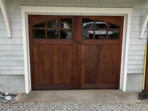 Final result: restored wooden garage door with renewed finish