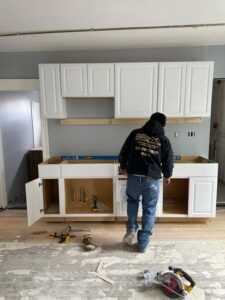 Cabinet installation in progress during the kitchen renovation