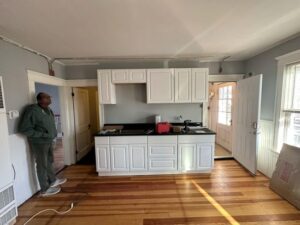 Final view of the kitchen renovation with new flooring and cabinetry