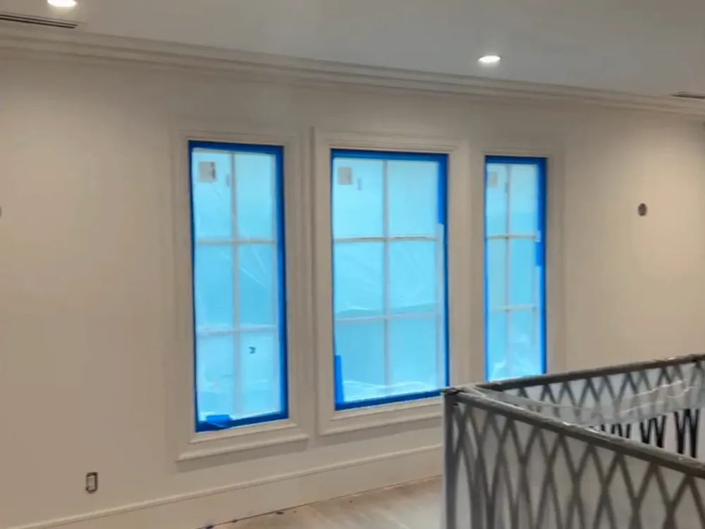 Interior residential renovation finishing with painted doors and protected flooring